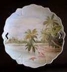 beach scene painted on a porcelain plate