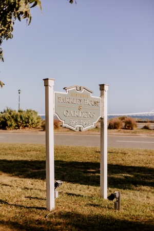 Barkley House sign with Pensacola Bay and Pensacola Bay Bridge in the background