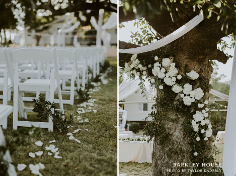 The exterior lawn of the Barkley House set up for a wedding ceremony with white chairs and florals